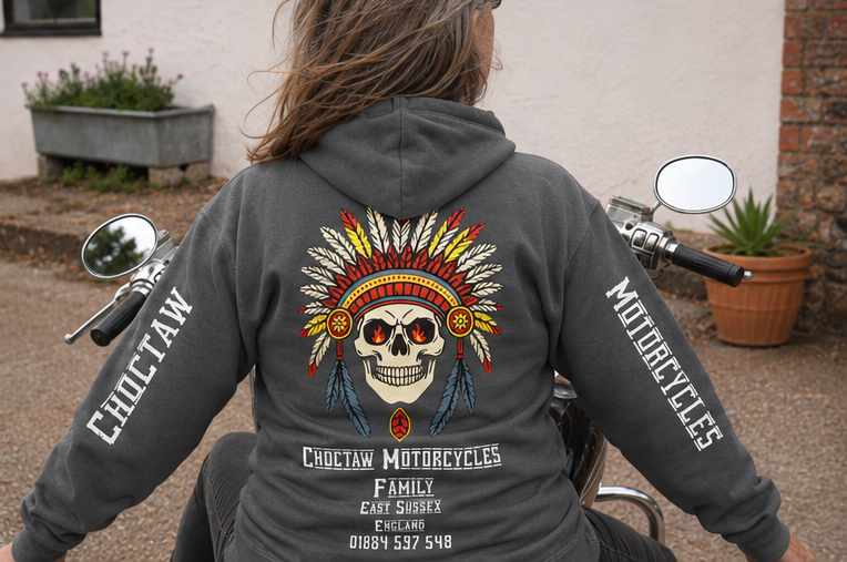 Person wearing a hoodie with a skull design and 'Choctaw Motorcycles' branding on a motorcycle.