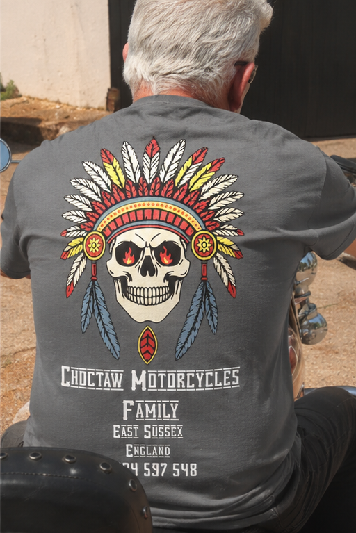 Person wearing a gray t-shirt with a skull and feathers design, featuring 'Choctaw Motorcycles' text.